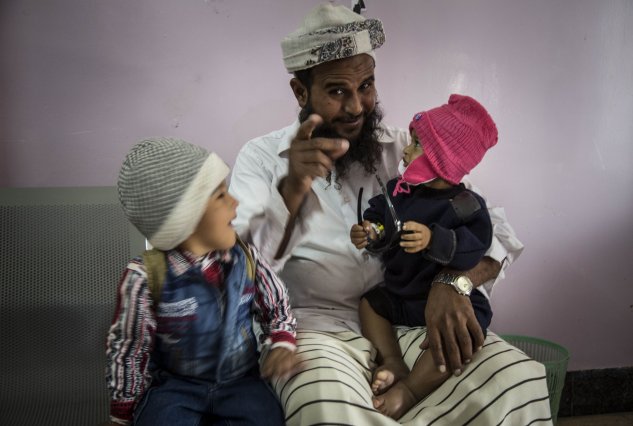 father and children in Yemen
